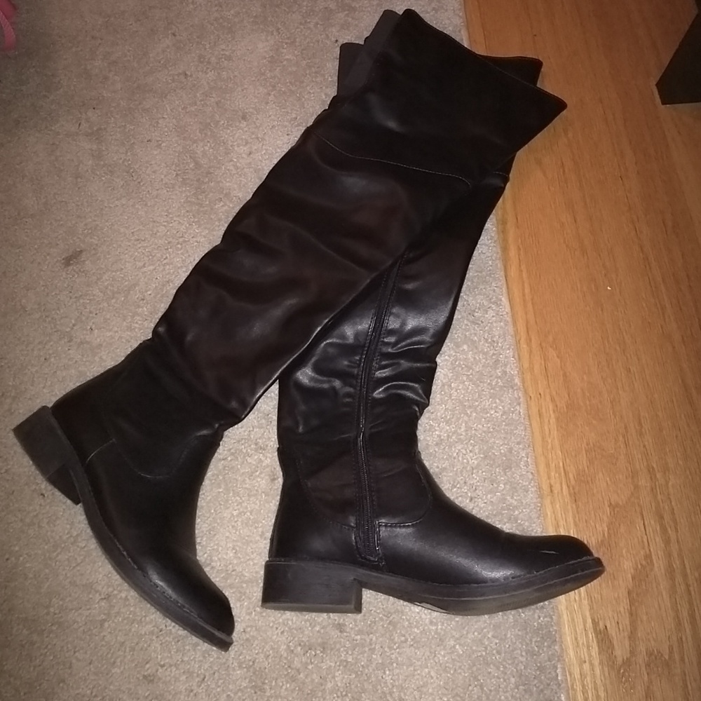 Thigh high leather boots.